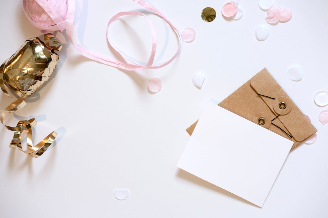 A blank card and envelope with festive decorations.