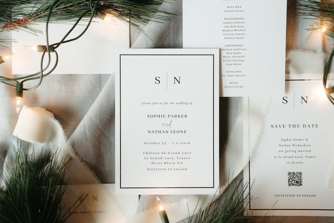 Wedding invitations with pine branches and lights